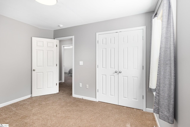 301 Glenlea Ln, Greenville, SC 29617 - unfurnished bedroom with baseboards, a closet, and carpet