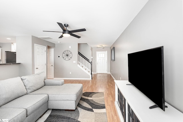 301 Glenlea Ln, Greenville, SC 29617 - living area featuring a ceiling fan, baseboards, visible vents, stairs, and light wood-type flooring