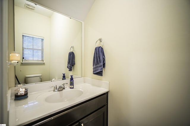 bathroom with toilet and vanity