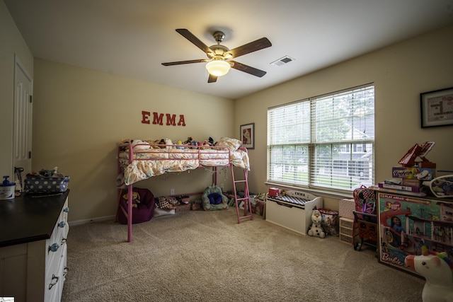 bedroom featuring carpet flooring, visible vents, and a ceiling fan