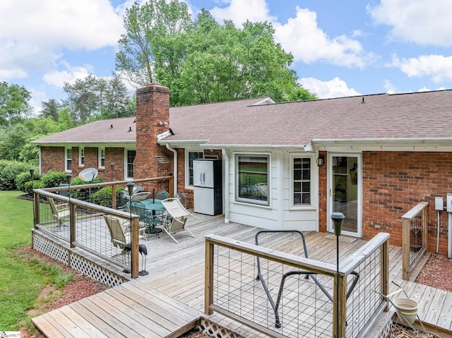 wooden deck with outdoor dining space