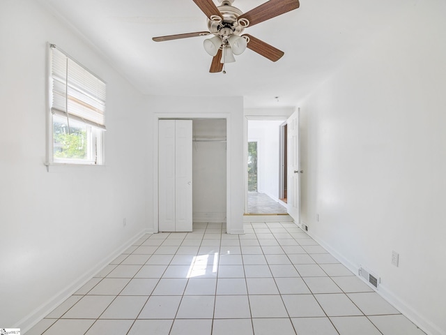 797 Jackson St, Spartanburg, SC 29303 - unfurnished bedroom featuring a closet, baseboards, light tile patterned floors, ceiling fan, and visible vents