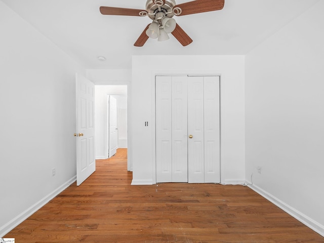 797 Jackson St, Spartanburg, SC 29303 - unfurnished bedroom featuring baseboards, a closet, and wood finished floors