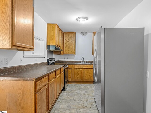 797 Jackson St, Spartanburg, SC 29303 - kitchen with a sink, brown cabinets, under cabinet range hood, dark countertops, and appliances with stainless steel finishes