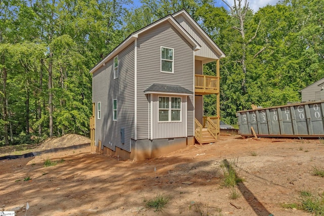 rear view of house with a balcony