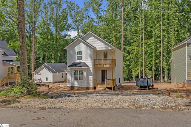 view of front facade featuring a balcony and board and batten siding