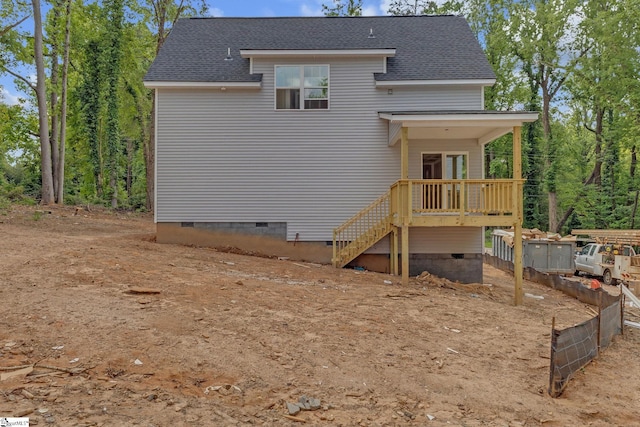 back of property with stairs, a wooden deck, roof with shingles, and crawl space