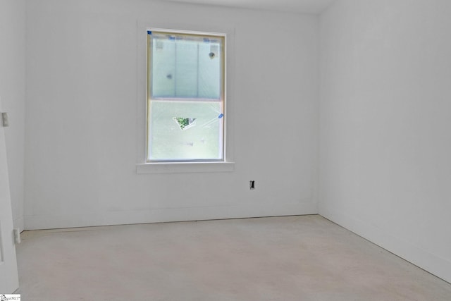 spare room featuring concrete flooring