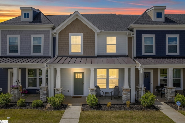 173 Dalmatian Dr, Spartanburg, SC 29307 - multi unit property featuring covered porch, a shingled roof, a lawn, and a standing seam roof