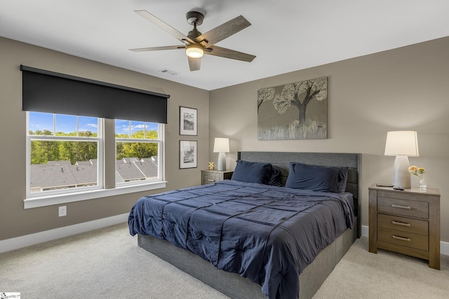 173 Dalmatian Dr, Spartanburg, SC 29307 - bedroom with baseboards, light carpet, visible vents, and a ceiling fan