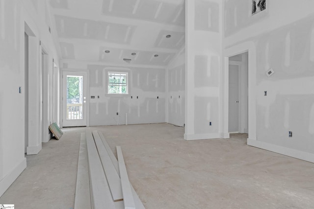 unfurnished living room with visible vents