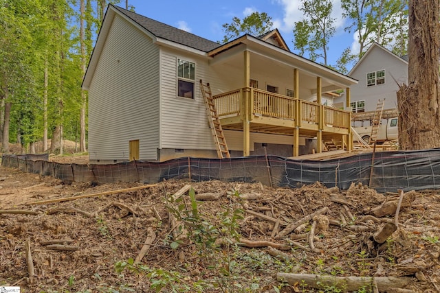 back of house with stairs, a wooden deck, fence, and crawl space