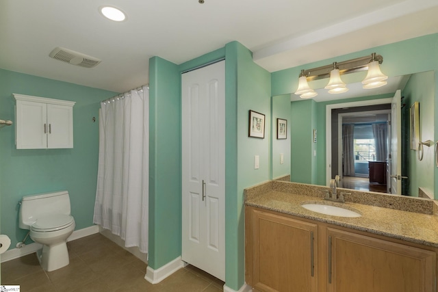 bathroom featuring toilet, baseboards, visible vents, tile patterned flooring, and vanity