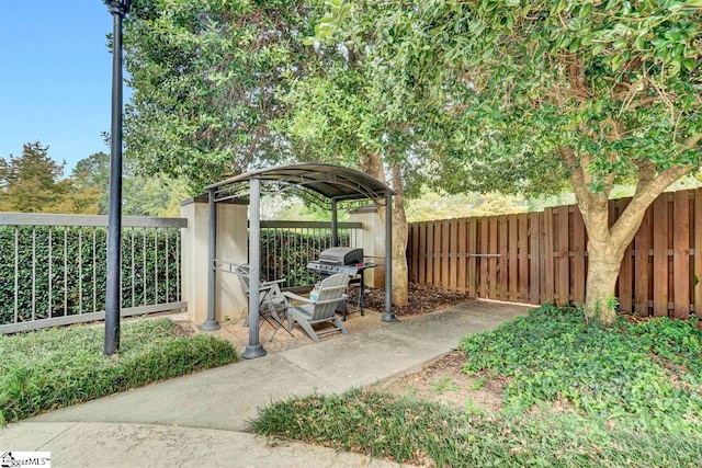 exterior space featuring a fenced backyard and grilling area