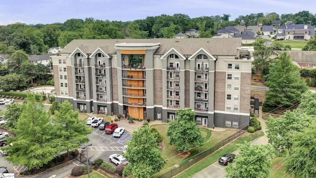 view of property with uncovered parking