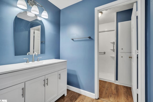 5 Huntley Castle Ct, Taylors, SC 29687 - bathroom featuring wood finished floors, a shower, baseboards, and vanity