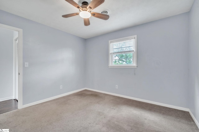 5 Huntley Castle Ct, Taylors, SC 29687 - spare room featuring dark colored carpet, baseboards, a ceiling fan, and visible vents