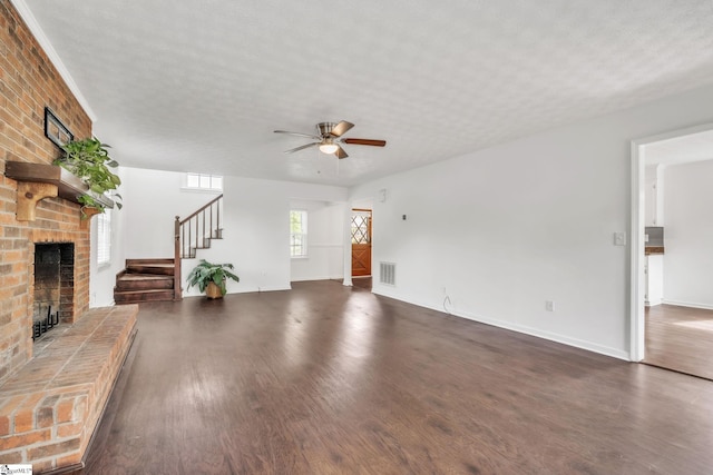 5 Huntley Castle Ct, Taylors, SC 29687 - unfurnished living room featuring stairs, wood finished floors, visible vents, a fireplace, and a ceiling fan
