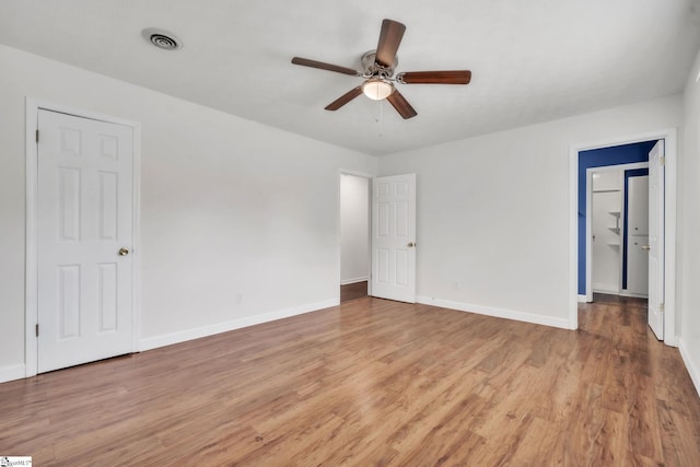 5 Huntley Castle Ct, Taylors, SC 29687 - unfurnished bedroom with light wood finished floors, visible vents, baseboards, and ceiling fan