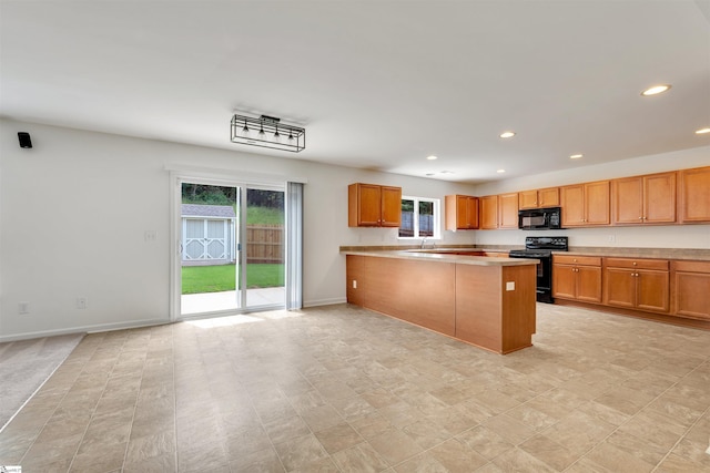kitchen with recessed lighting, baseboards, a peninsula, black appliances, and light countertops