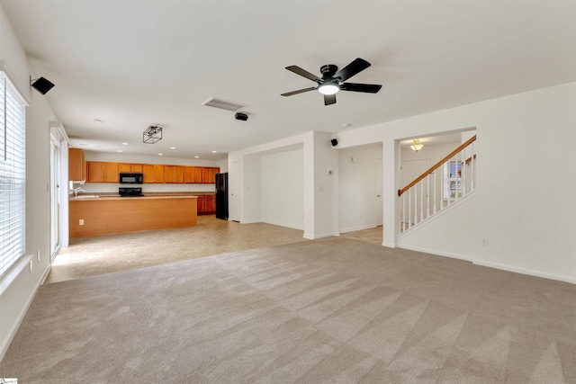 unfurnished living room featuring a ceiling fan, recessed lighting, visible vents, and light colored carpet