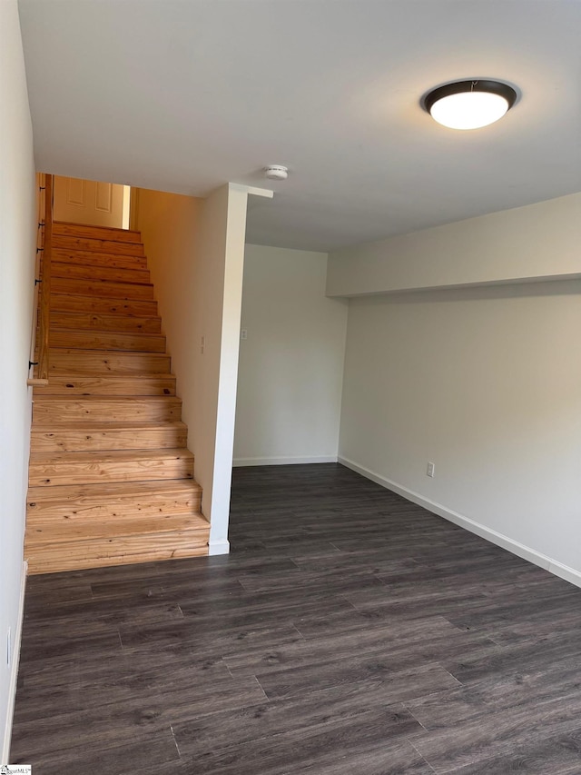 stairs with baseboards and wood finished floors