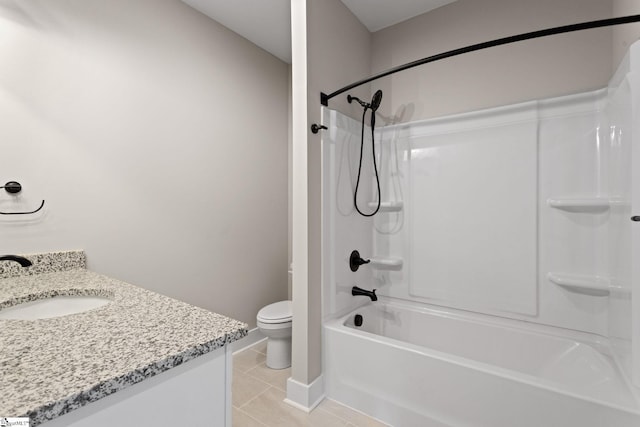 full bath with toilet, vanity, tile patterned flooring, washtub / shower combination, and baseboards