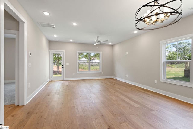 empty room with light wood-style flooring, baseboards, visible vents, and recessed lighting