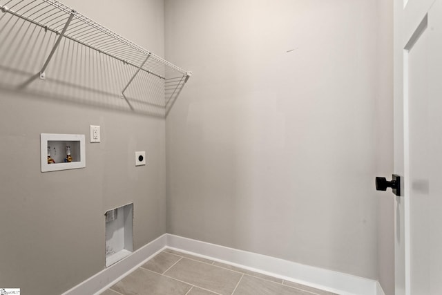 clothes washing area featuring laundry area, hookup for an electric dryer, tile patterned flooring, baseboards, and hookup for a washing machine