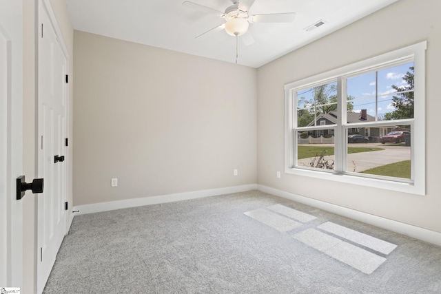 unfurnished bedroom featuring baseboards, ceiling fan, carpet flooring, and visible vents