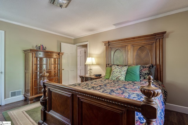 bedroom featuring crown molding, baseboards, dark wood-type flooring, and visible vents