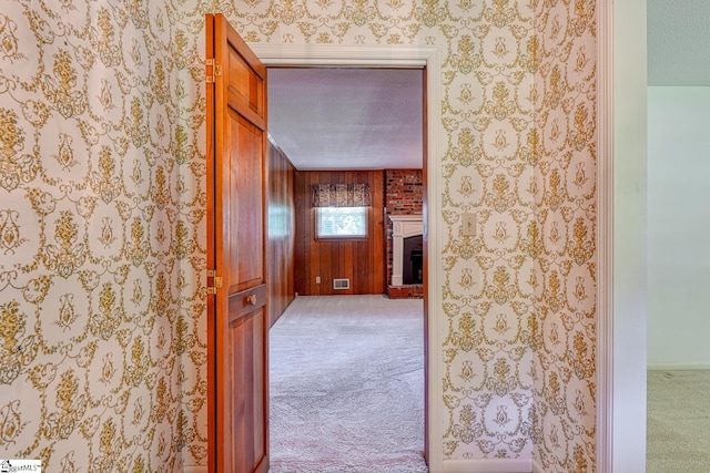corridor featuring visible vents and carpet floors
