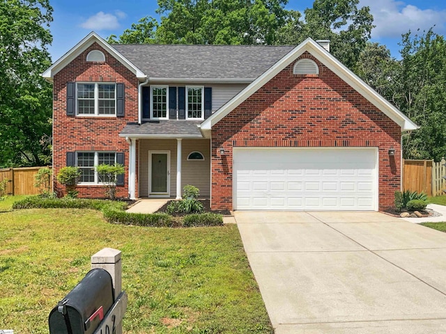 102 Thurber Way, Simpsonville, SC 29681 - traditional home with an attached garage, fence, concrete driveway, a front lawn, and brick siding