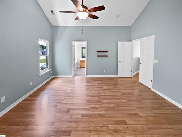 102 Thurber Way, Simpsonville, SC 29681 - unfurnished bedroom with high vaulted ceiling, light wood-type flooring, visible vents, baseboards, and ensuite bath