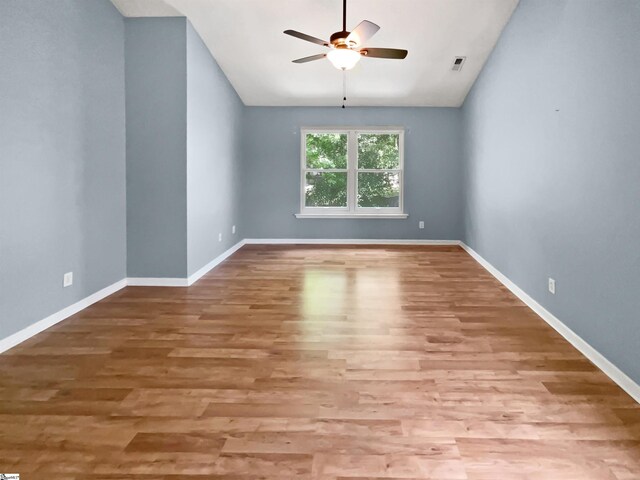 102 Thurber Way, Simpsonville, SC 29681 - unfurnished room featuring a ceiling fan, wood finished floors, and vaulted ceiling
