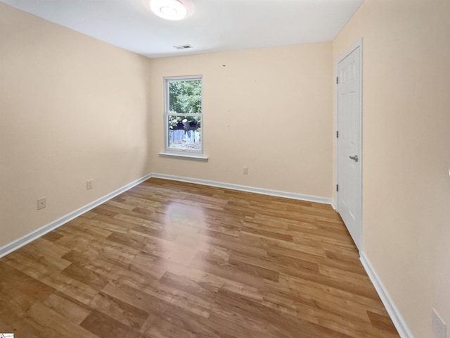 102 Thurber Way, Simpsonville, SC 29681 - spare room featuring baseboards, visible vents, and wood finished floors