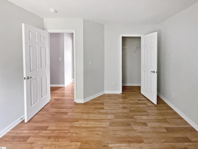 102 Thurber Way, Simpsonville, SC 29681 - unfurnished bedroom featuring light wood-type flooring, baseboards, and a closet
