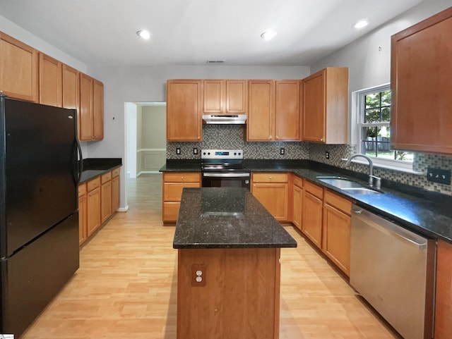102 Thurber Way, Simpsonville, SC 29681 - kitchen with a sink, stainless steel appliances, under cabinet range hood, light wood finished floors, and a center island