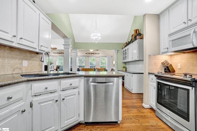 6 Shallow Creek Ct, Fountain Inn, SC 29644 - kitchen with a sink, white cabinetry, stainless steel appliances, light wood-type flooring, and ornate columns