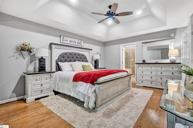 6 Shallow Creek Ct, Fountain Inn, SC 29644 - bedroom featuring light wood-style flooring, a ceiling fan, ensuite bathroom, baseboards, and a raised ceiling