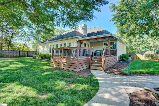 6 Shallow Creek Ct, Fountain Inn, SC 29644 - back of property featuring a wooden deck, a chimney, a lawn, and a fenced backyard