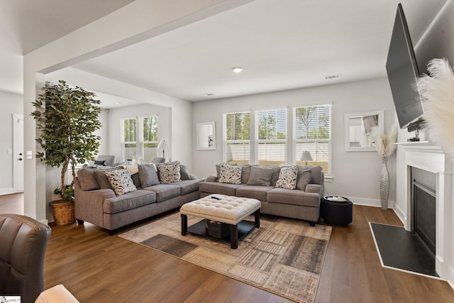 481 Fenwick Dr, Woodruff, SC 29388 - living room featuring recessed lighting, a fireplace with raised hearth, baseboards, visible vents, and wood finished floors