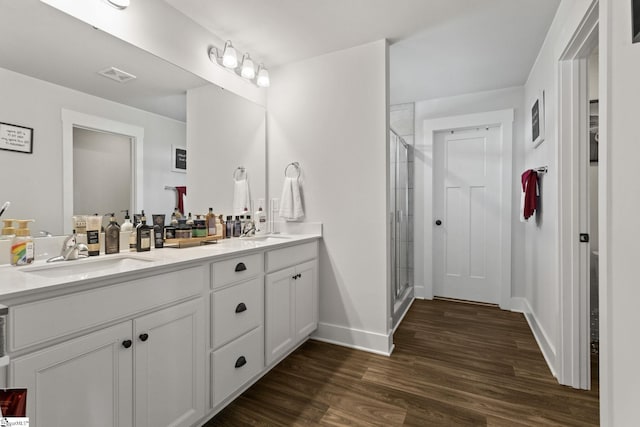 481 Fenwick Dr, Woodruff, SC 29388 - bathroom with wood finished floors, a shower stall, and a sink