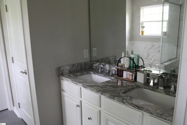 bathroom with double vanity and a sink