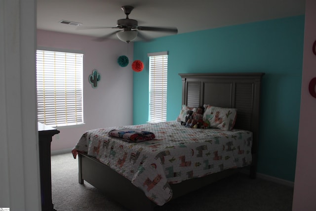 bedroom featuring ceiling fan, carpet, baseboards, and visible vents
