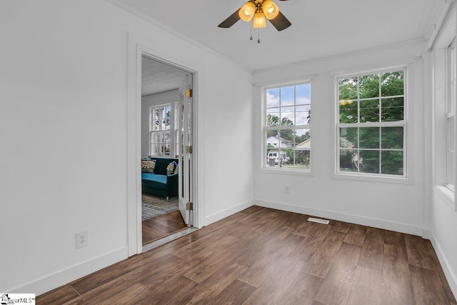 14 N Haven Dr, Greenville, SC 29617 - empty room with dark wood-style flooring, ornamental molding, a healthy amount of sunlight, and visible vents
