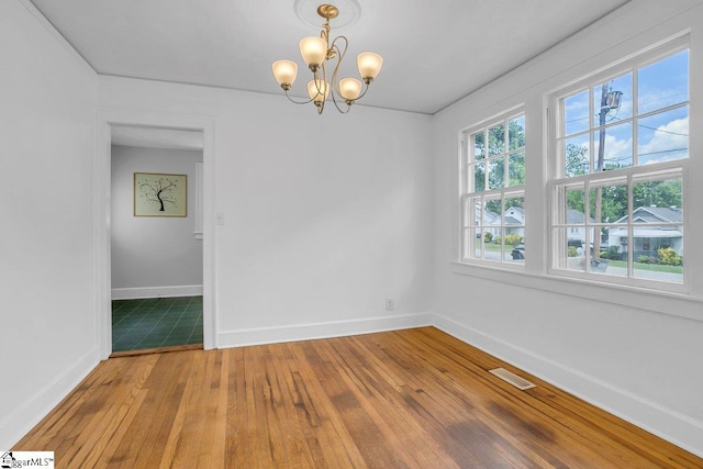14 N Haven Dr, Greenville, SC 29617 - spare room featuring baseboards, hardwood / wood-style floors, a chandelier, and visible vents