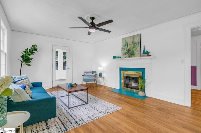 14 N Haven Dr, Greenville, SC 29617 - living area with a fireplace with flush hearth, baseboards, a ceiling fan, and wood finished floors