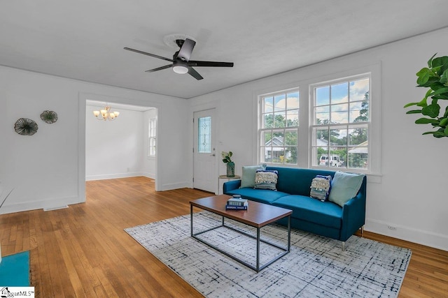 14 N Haven Dr, Greenville, SC 29617 - living area with ceiling fan with notable chandelier, baseboards, visible vents, and wood finished floors