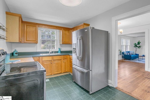 14 N Haven Dr, Greenville, SC 29617 - kitchen with dark tile patterned floors, stainless steel fridge with ice dispenser, a sink, and black range with electric cooktop
